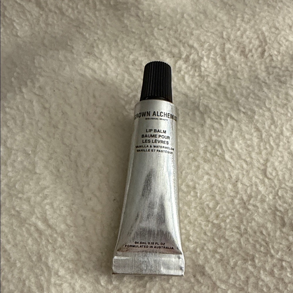 Grown Alchemist Silver Lip Balm Tube with Black Cap